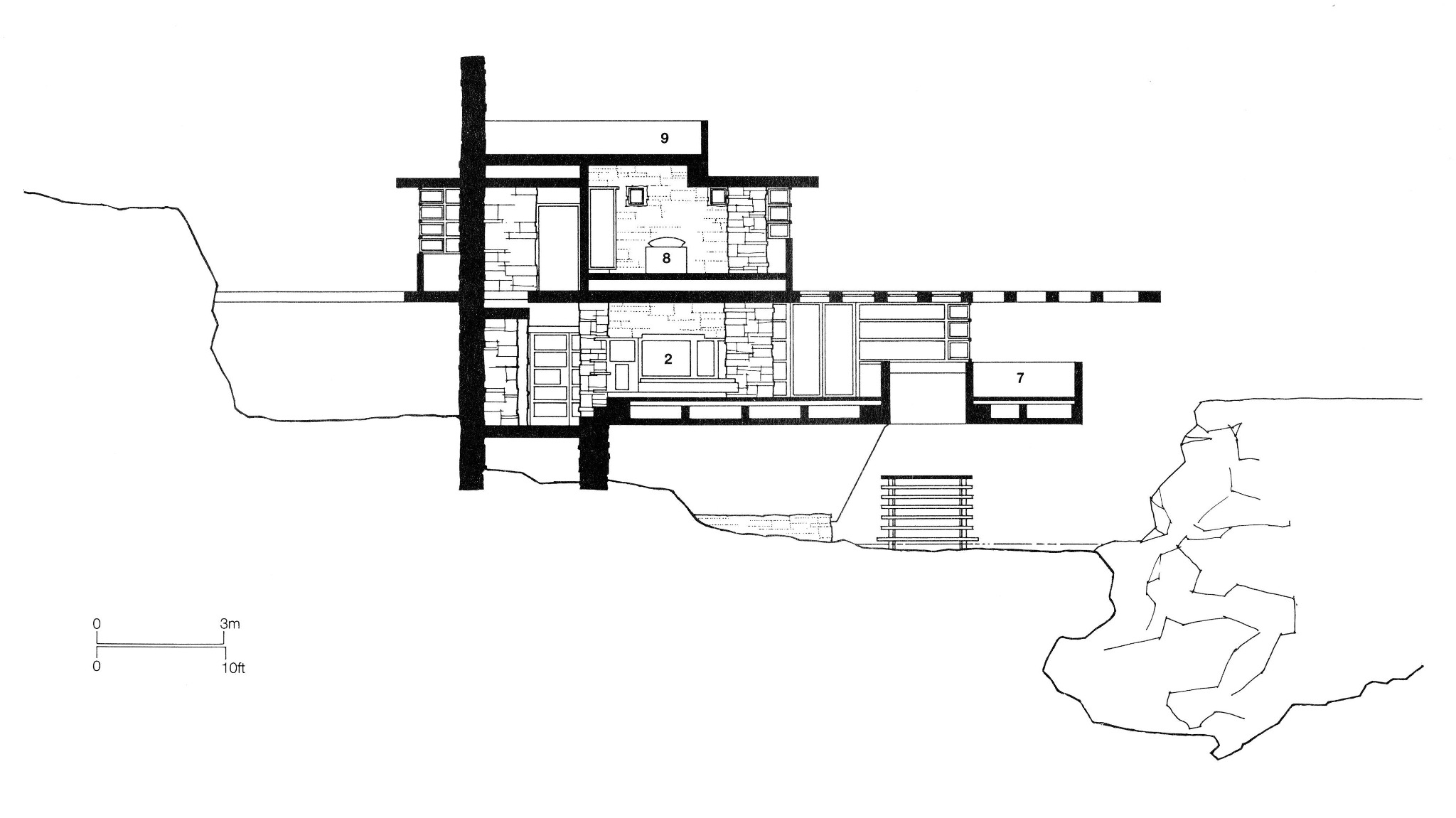 Section across the house showing the hillside, two inhabited levels, terraces, chimney mass and water stair.